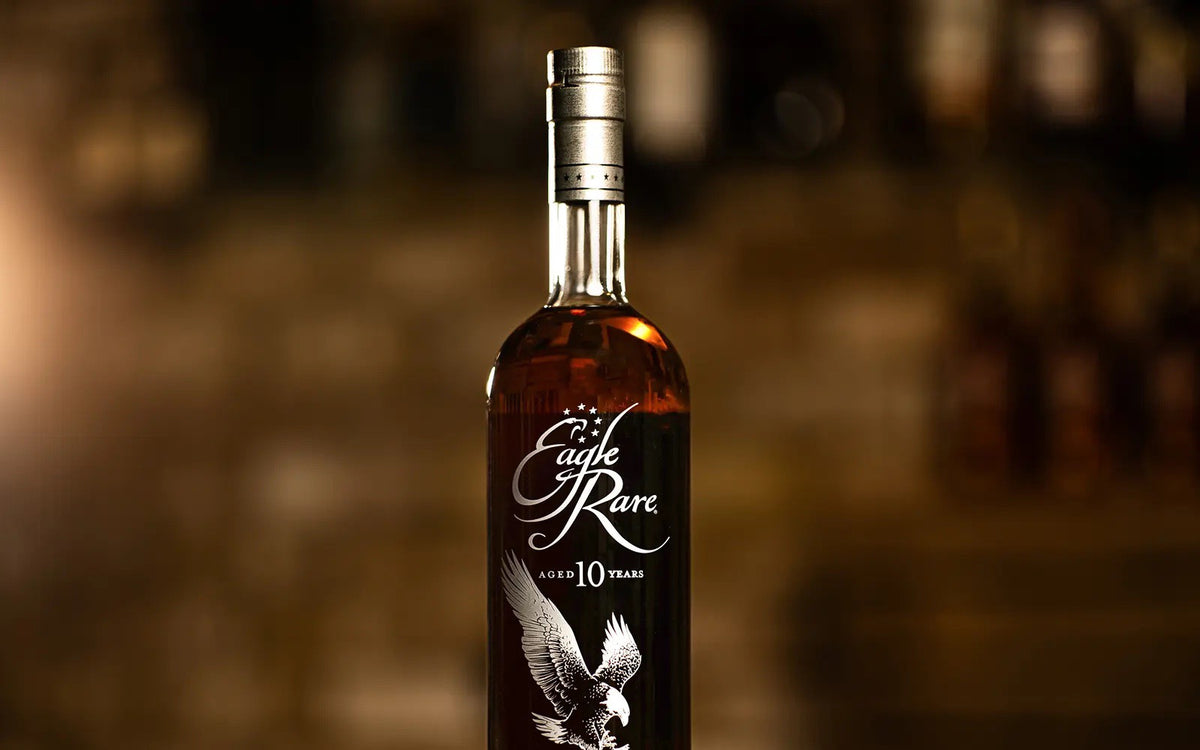 Bottle of Eagle Rare 10 Year Kentucky straight bourbon in a dimly lit bar