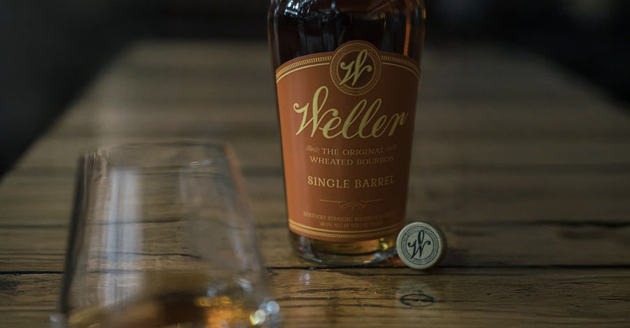 Weller Single Barrel bourbon on a wooden bar with a glass
